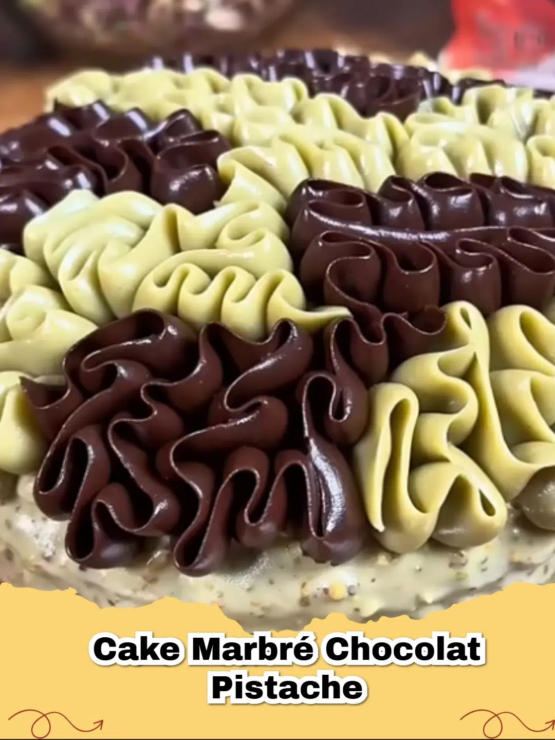 A delectable slice of Cake Marbré Chocolat Pistache showcasing the beautiful swirl of green pistachio and rich chocolate.