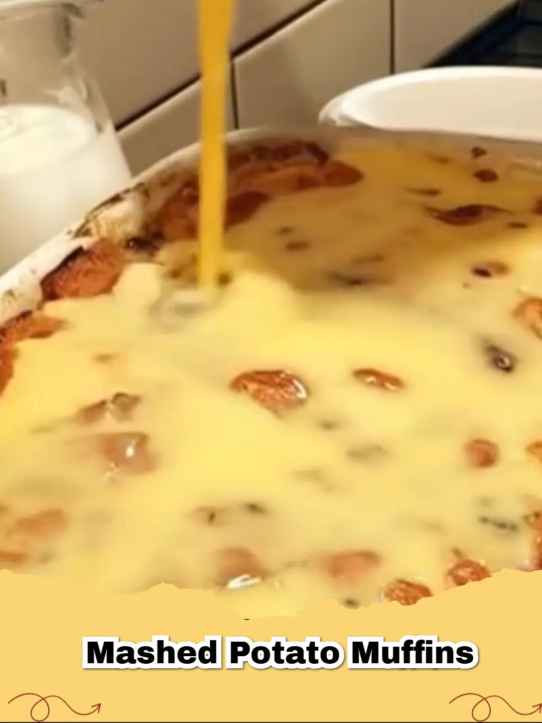 Close-up of golden brown cheesy chive leftover mashed potato muffins in a muffin tin, garnished with fresh chives.