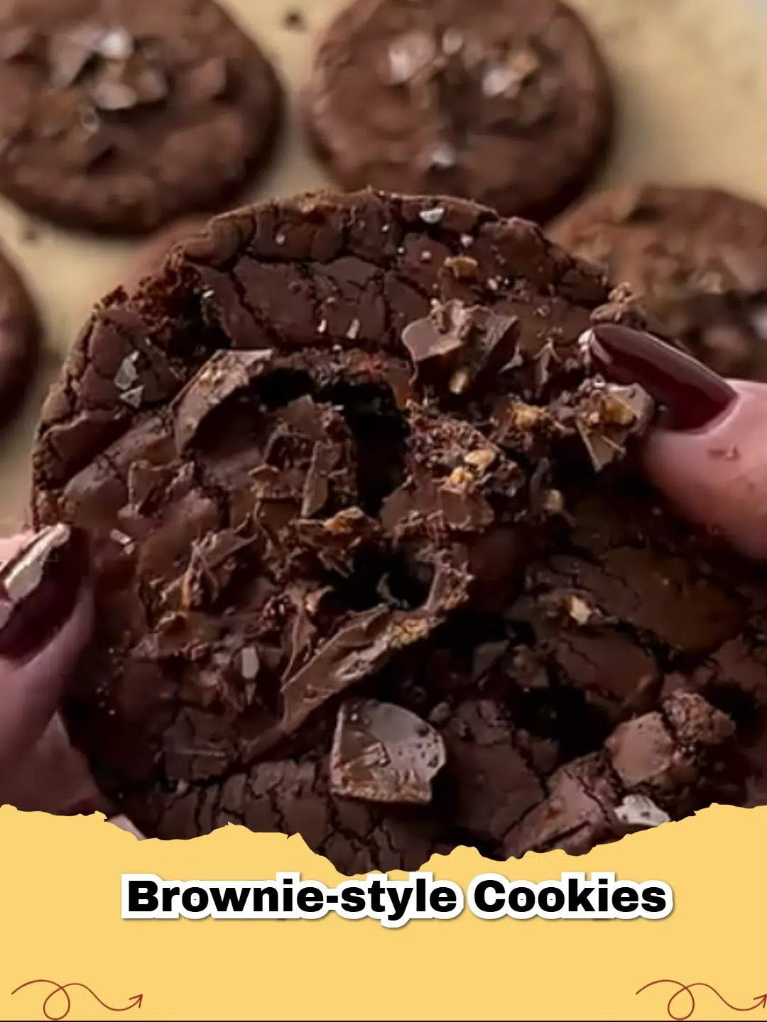 Close-up of freshly baked chewy, fudgy brownie-style cookies with chocolate chips.