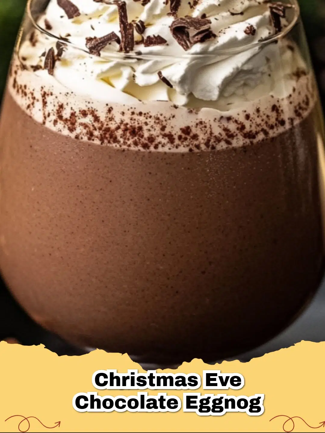 Festive glass of creamy Christmas Chocolate Eggnog garnished with whipped cream, chocolate shavings, and a candy cane.