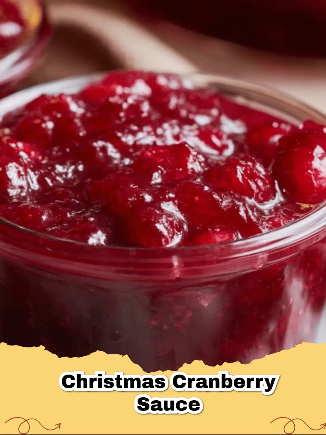 Delicious homemade Christmas Orange Cranberry Sauce in a festive bowl garnished with fresh orange zest.