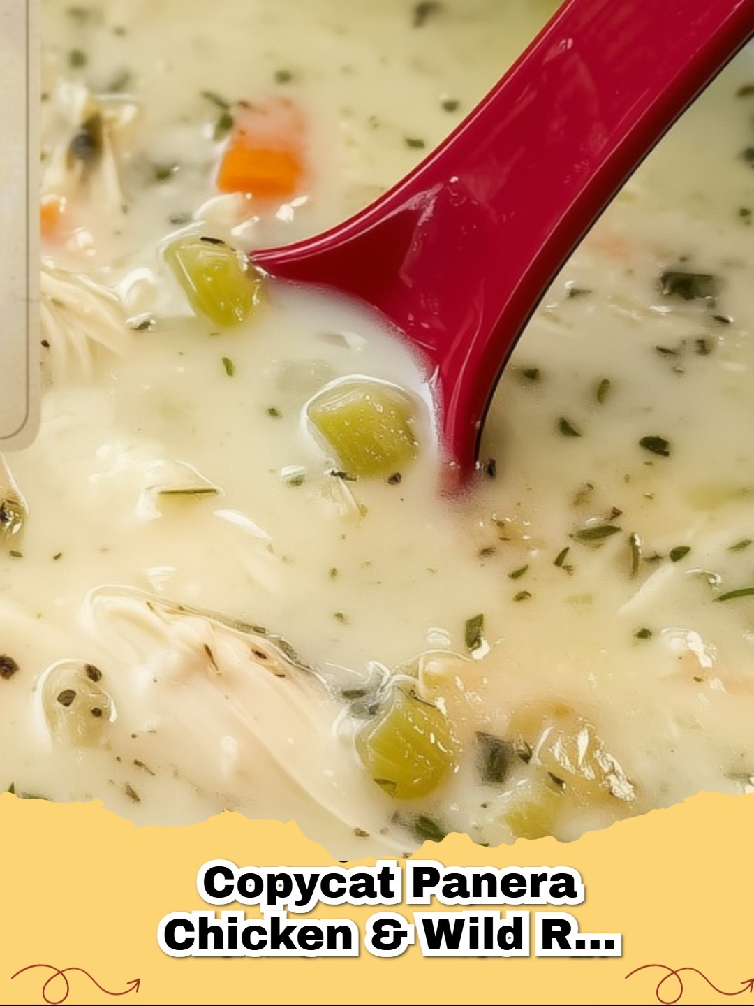 Creamy homemade Copycat Panera Chicken and Wild Rice Soup served in a white bowl with a spoon and crusty bread