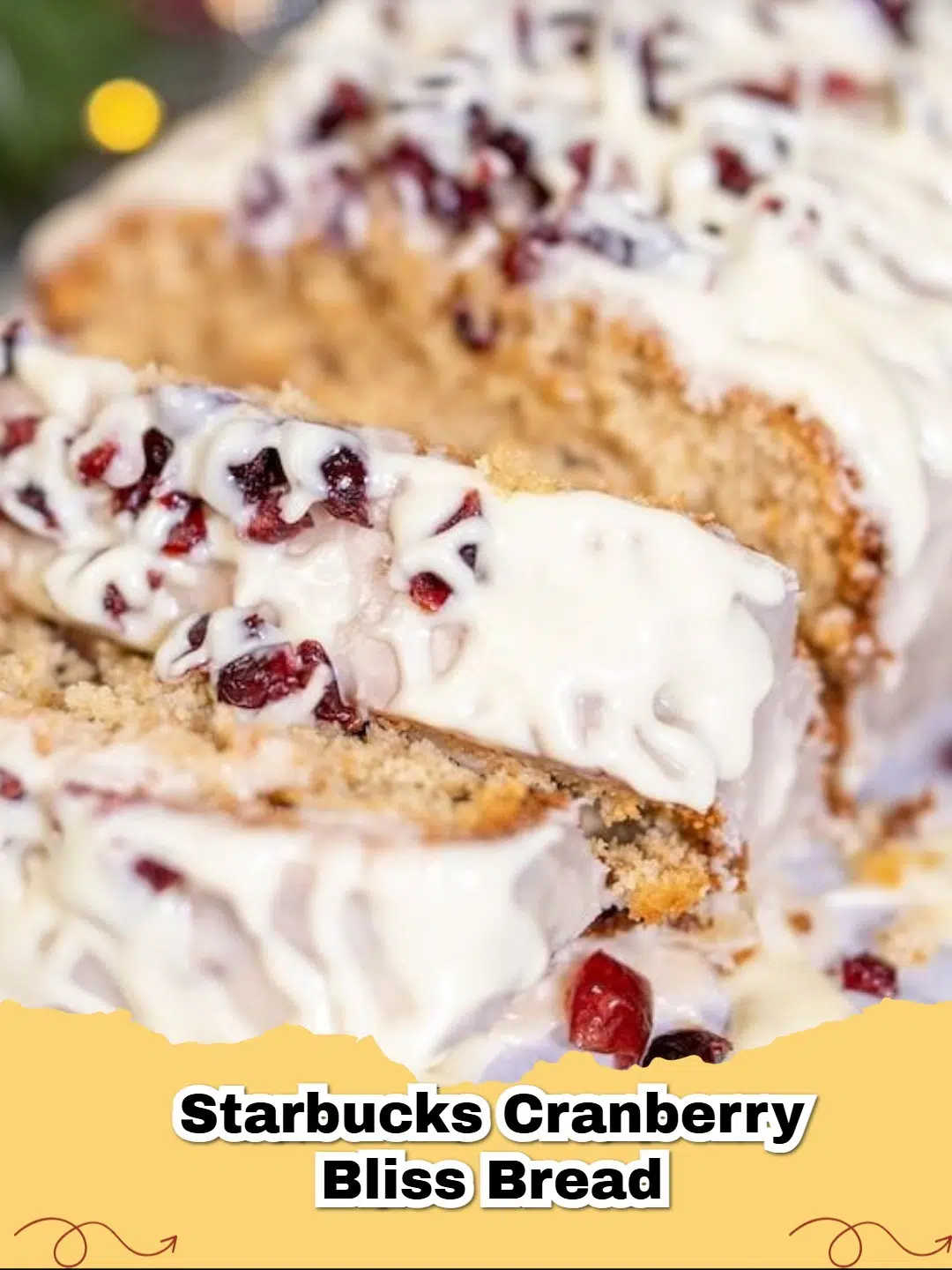 Delicious slice of Copycat Starbucks Cranberry Bliss Bread with white chocolate drizzle and cranberries.