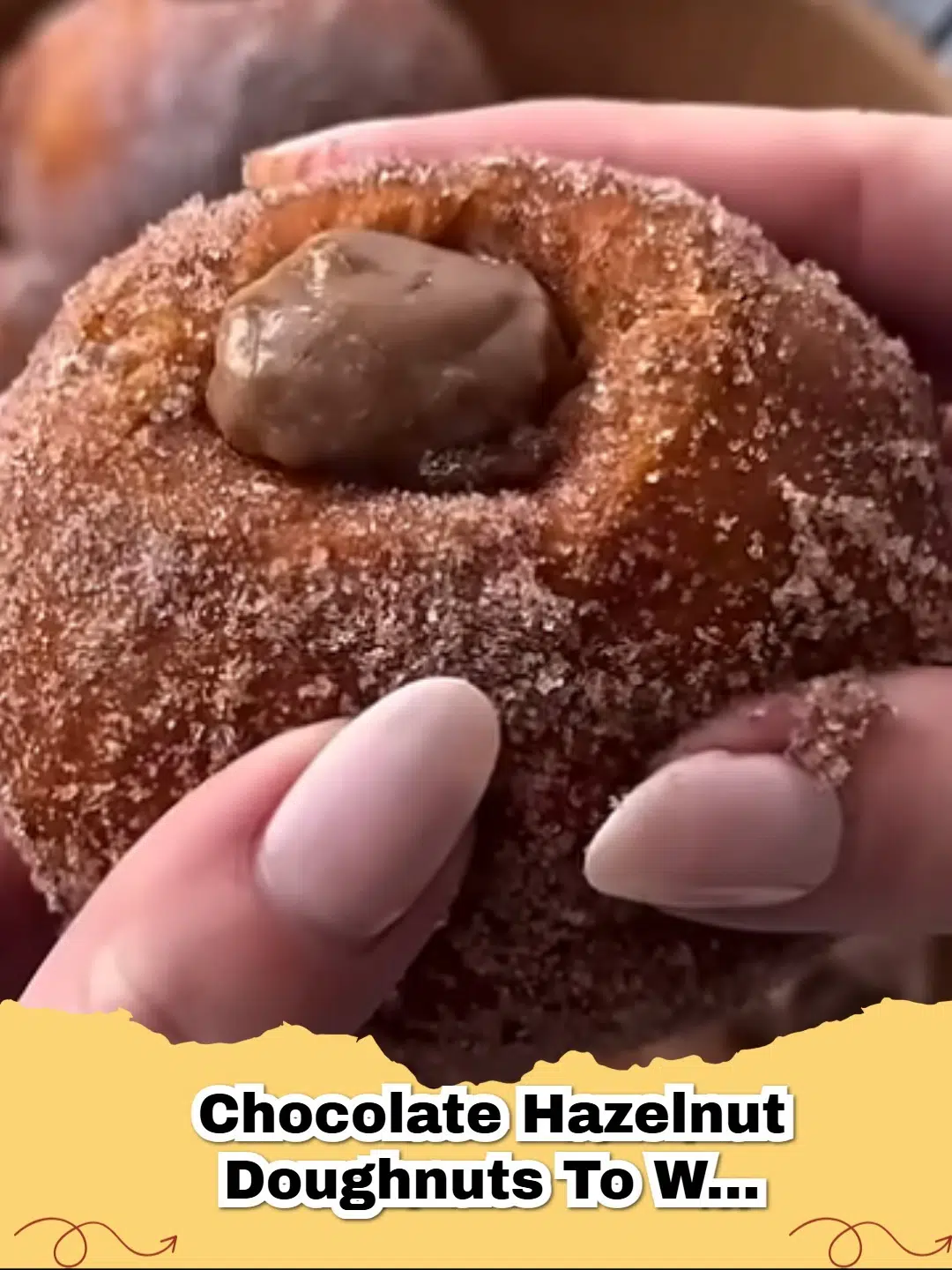Delicious homemade chocolate hazelnut doughnuts topped with glaze and chopped hazelnuts, perfect for a warm treat.