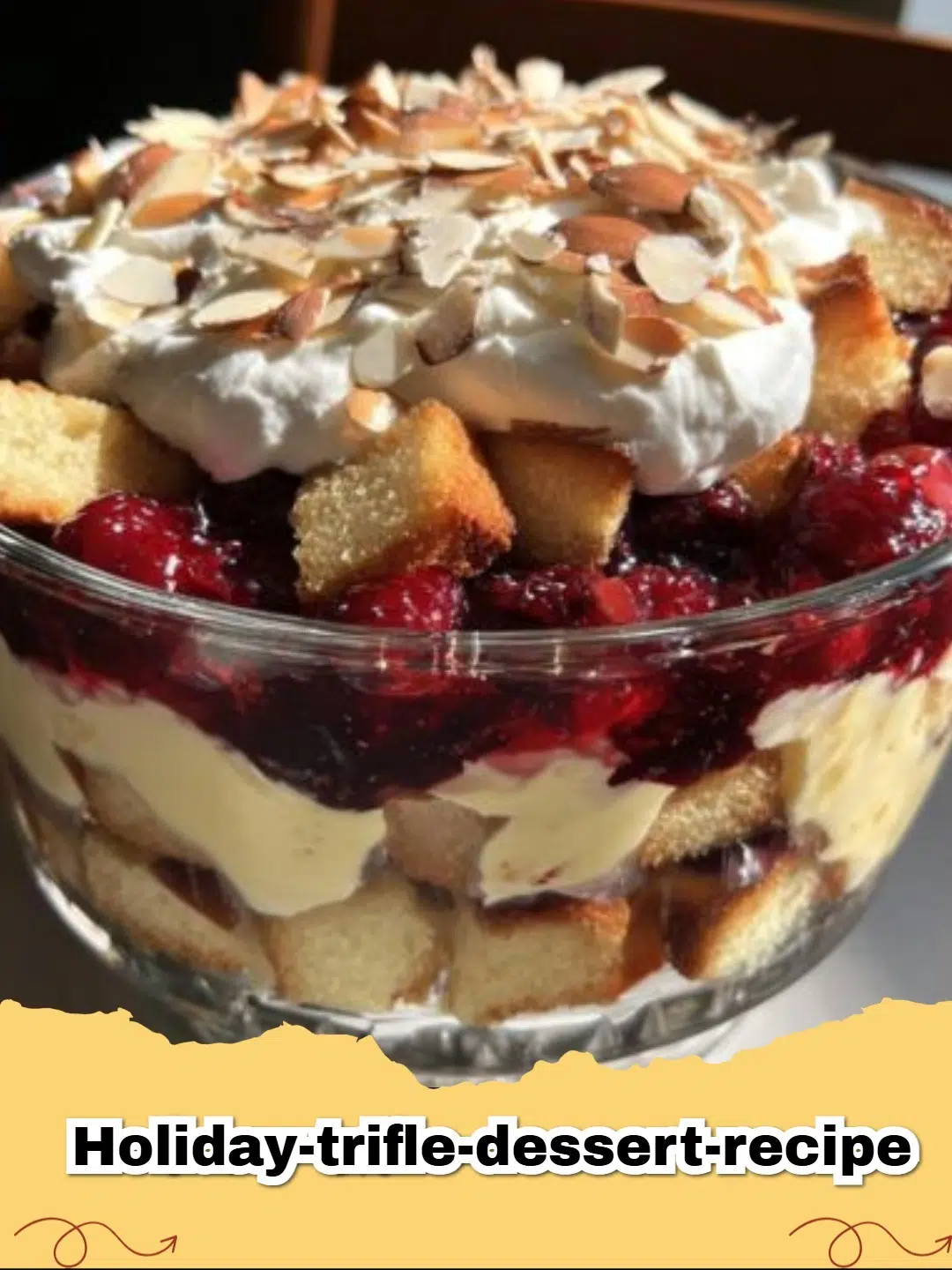 Beautifully layered Holiday Trifle dessert with colorful berries and creamy whipped topping, perfect for festive tables.