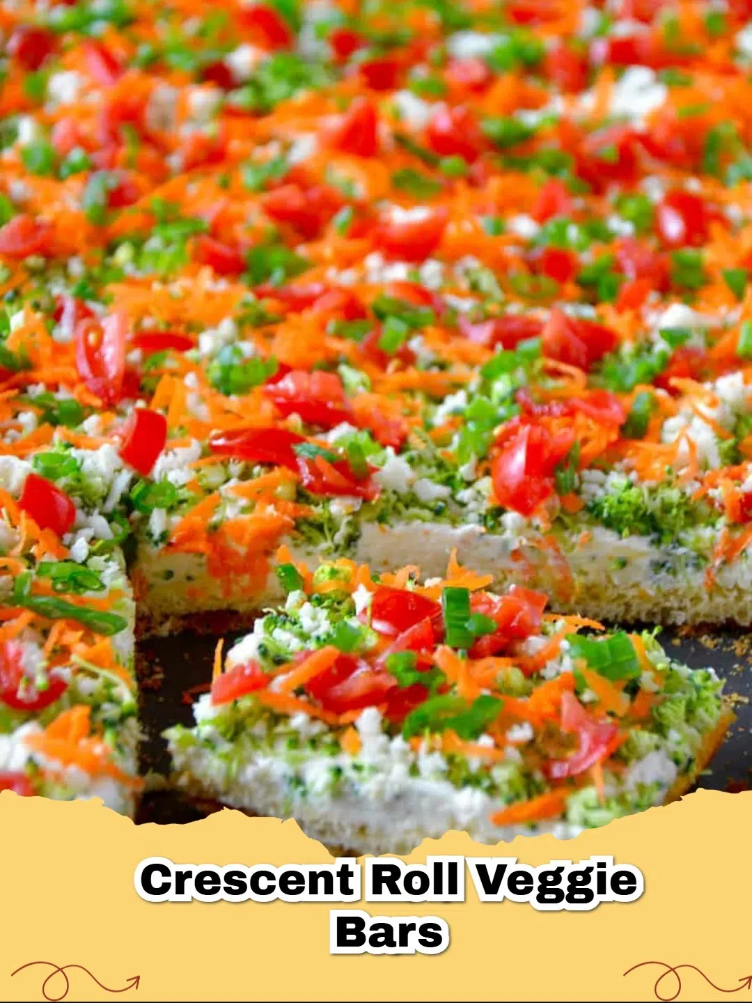 Close-up of vibrant Crescent Roll Veggie Bars topped with fresh vegetables, perfect for a party.