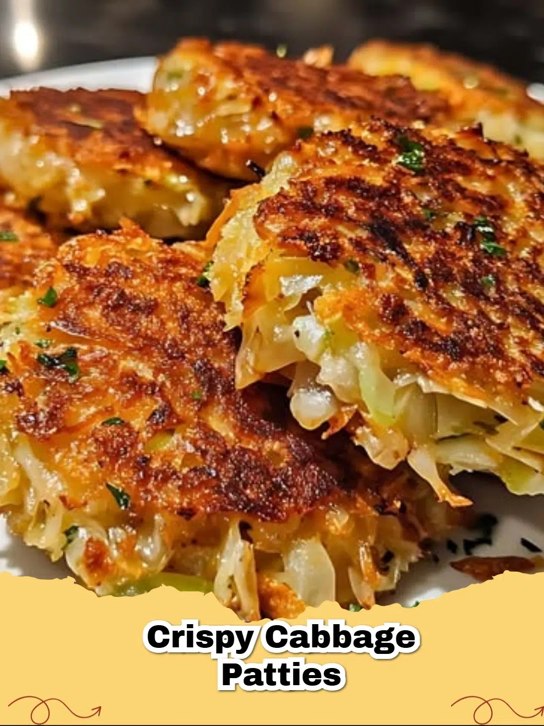 Golden brown, crispy cabbage patties served hot on a plate with sour cream