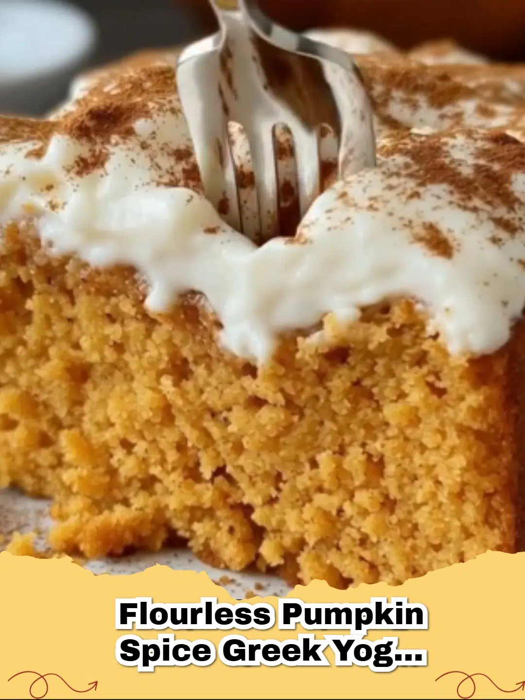 Slice of moist Flourless Pumpkin Spice Greek Yogurt Cake with a dusting of powdered sugar