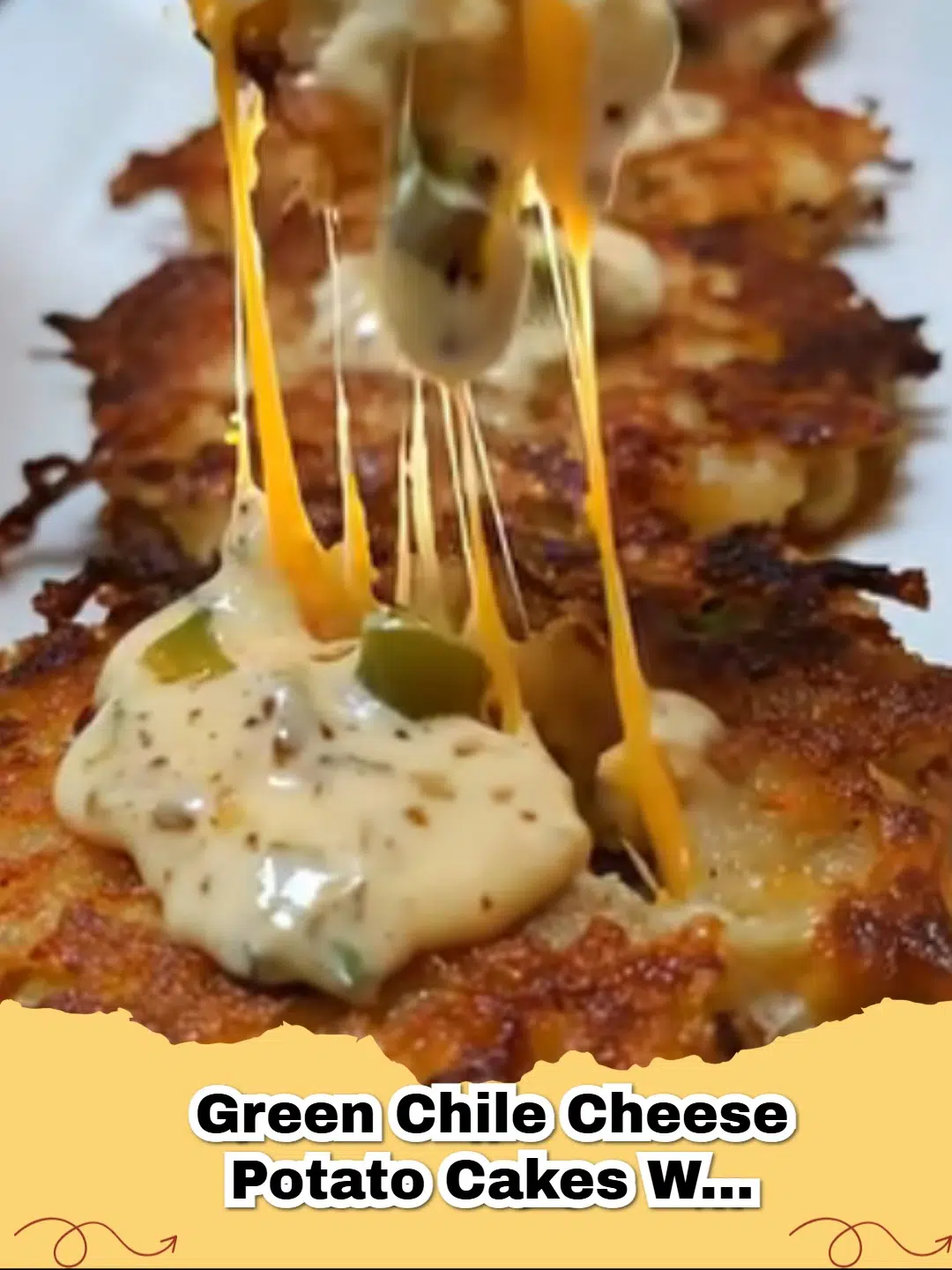 Golden green chile cheese potato cakes stacked with a side of creamy green chile sour cream.