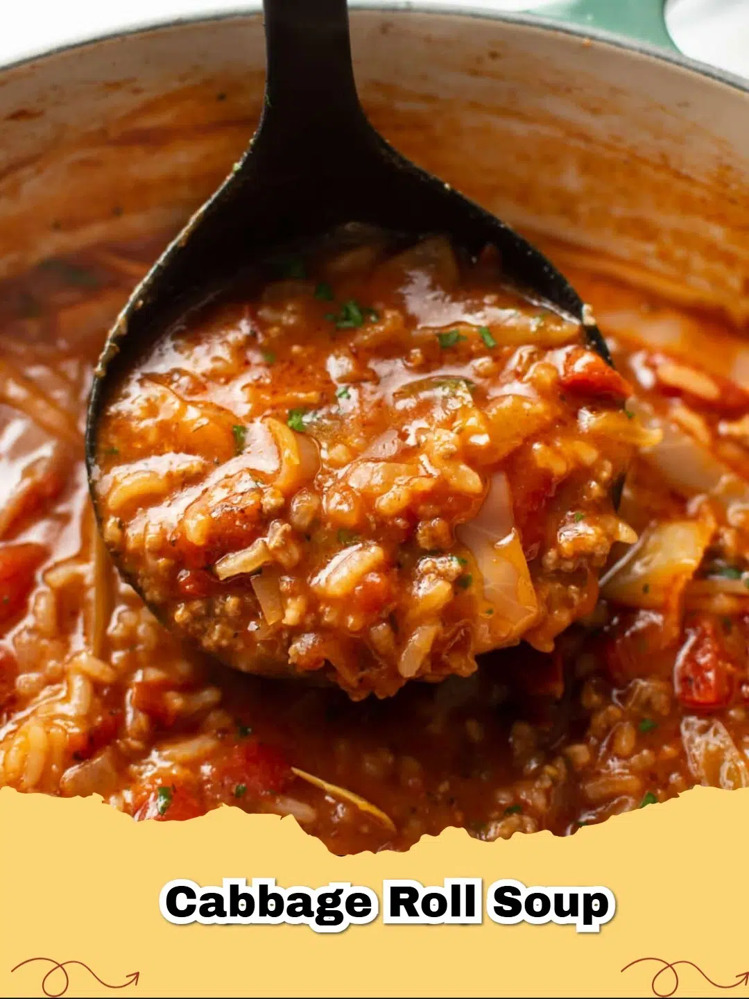 A steaming bowl of hearty beef and rice cabbage roll soup garnished with fresh parsley.