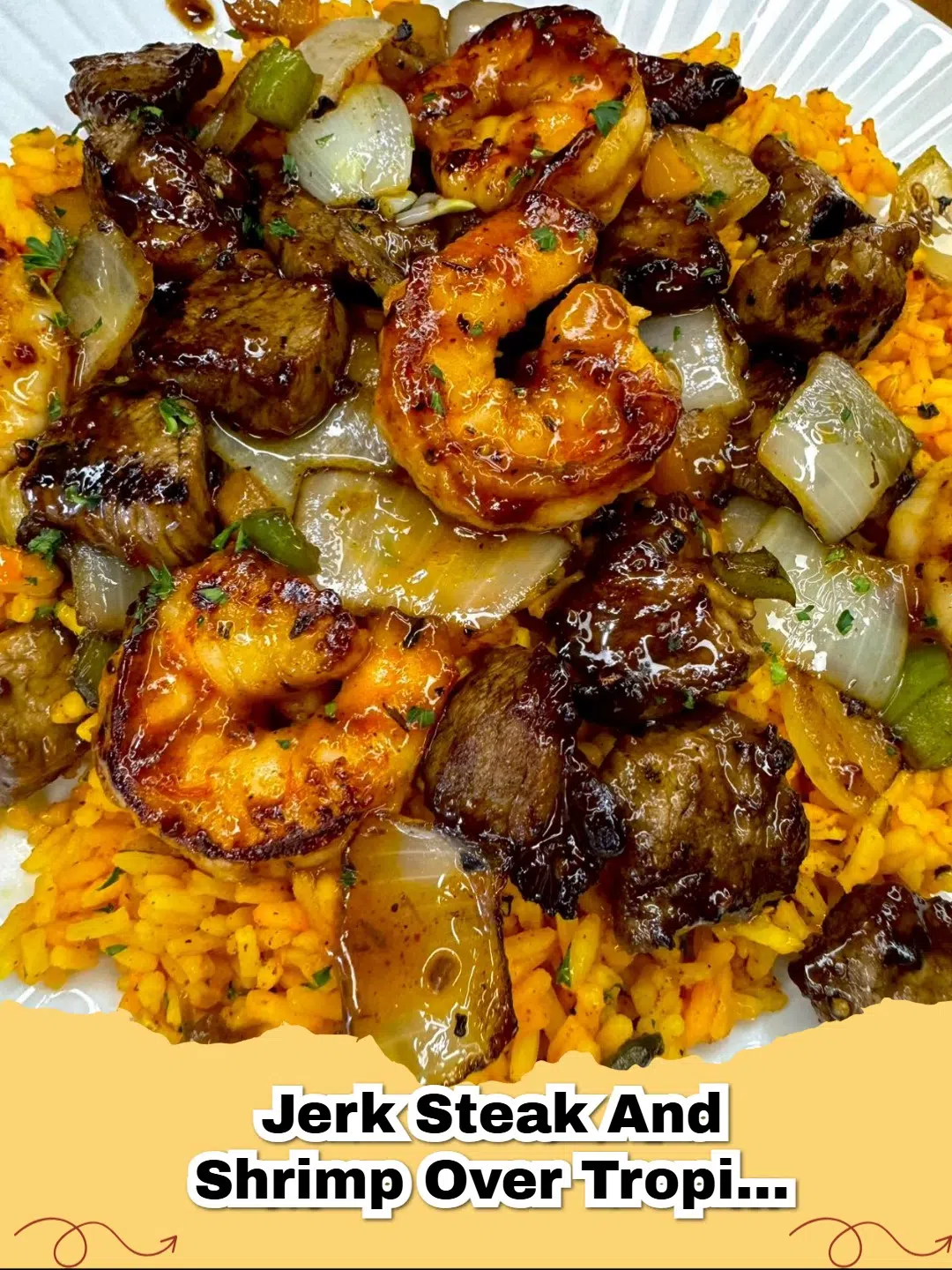 Plated Jerk Steak and Shrimp over vibrant Tropical Coconut Rice with pineapple and peppers.