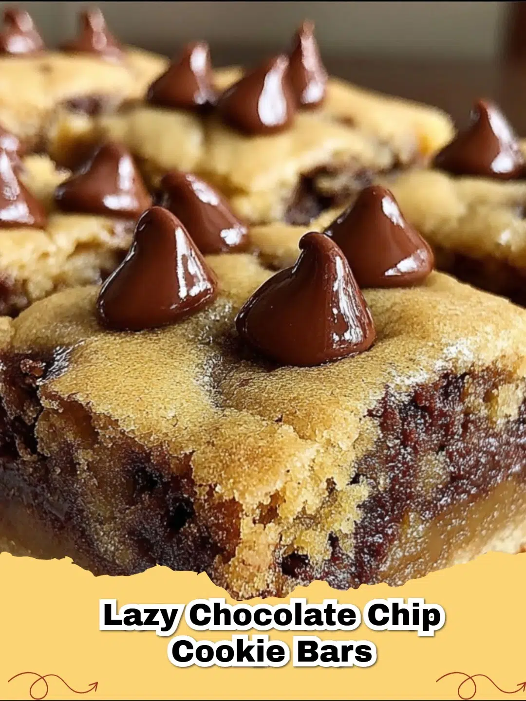 Close-up of baked Lazy Cake Mix Chocolate Chip Cookie Bars in a pan, with some cut into squares, showcasing melted chocolate chips.