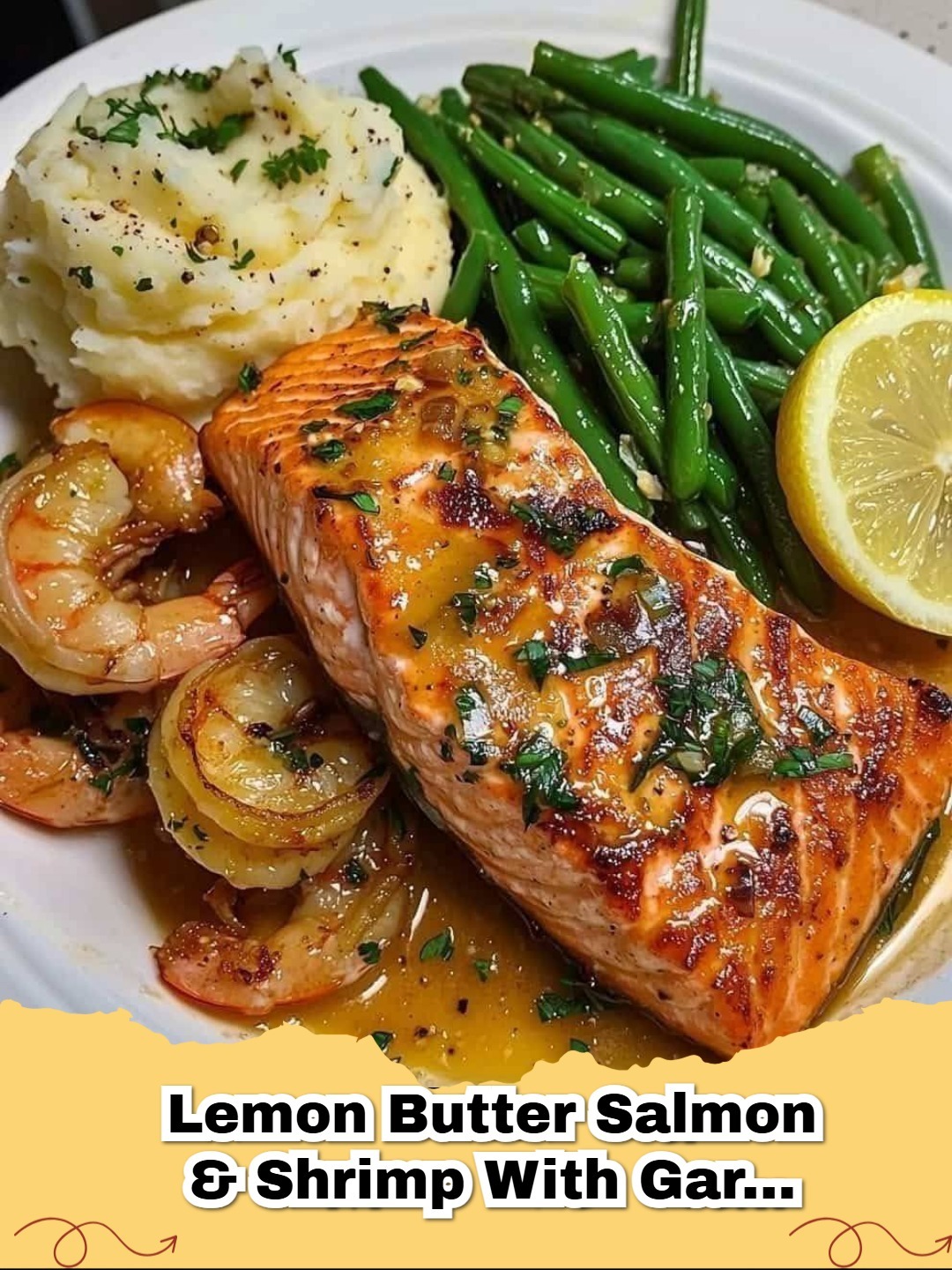 Plated Lemon Butter Salmon and Shrimp with Garlic Mashed Potatoes and Sautéed Green Beans
