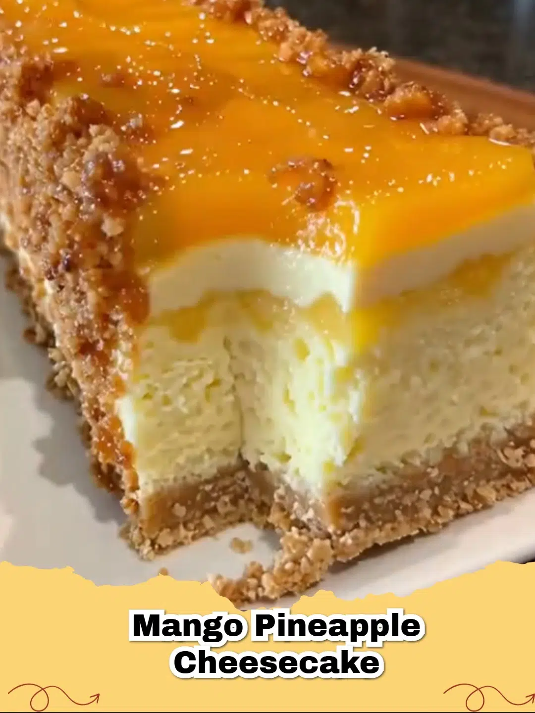 Delicious Mango Pineapple Cheesecake with tropical fruit garnish, showing a beautiful swirl pattern.