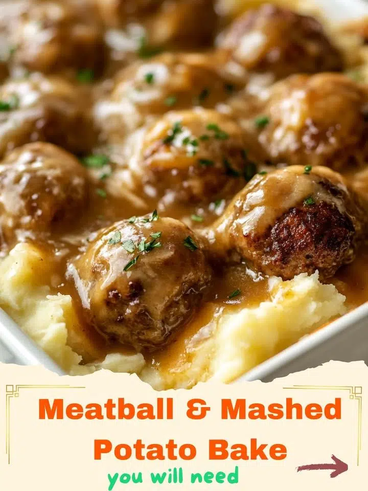 A close-up shot of a golden-brown Meatball & Mashed Potato Bake in a casserole dish, topped with melted cheese and fresh parsley.