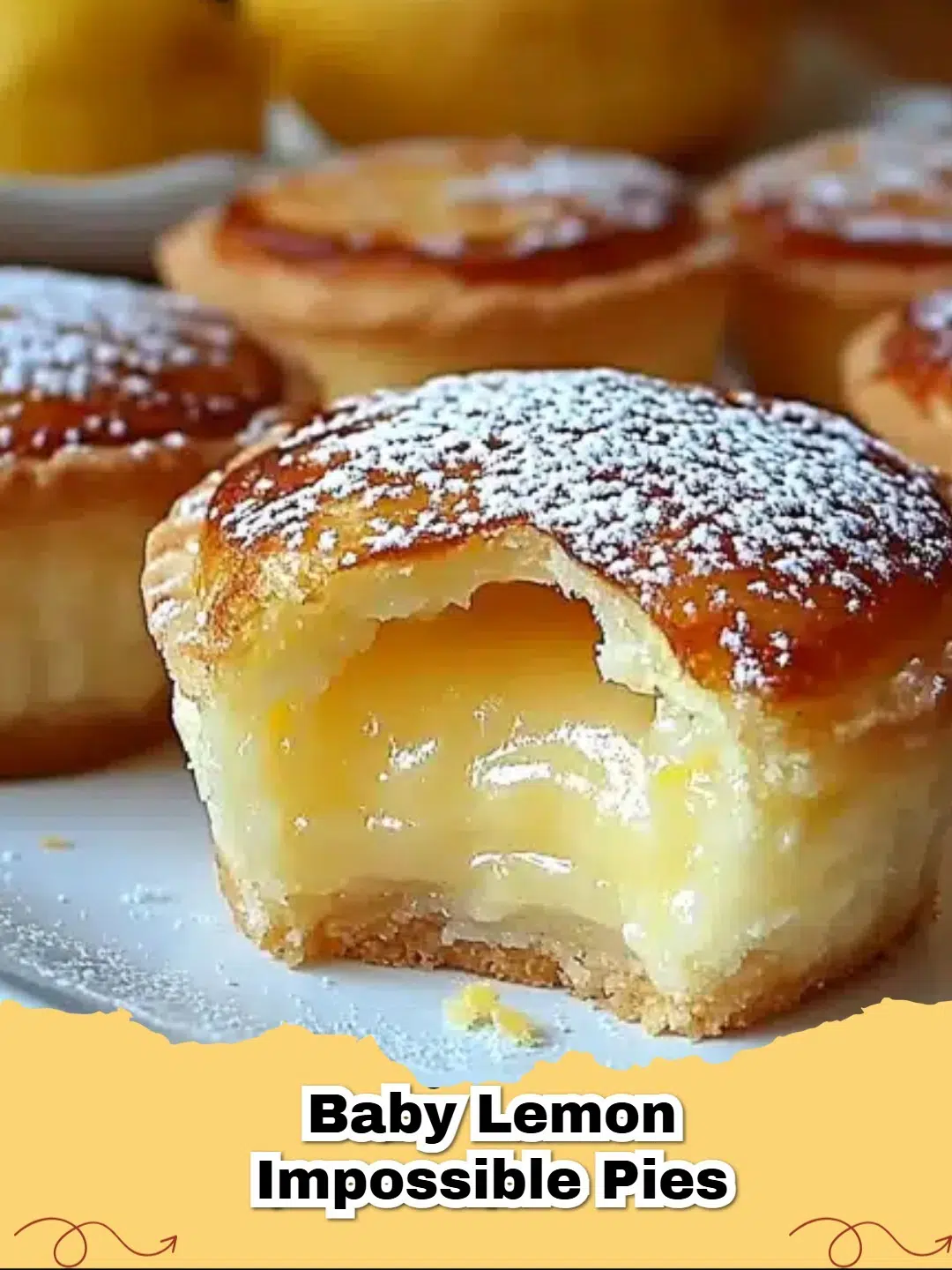 Delicious individual Mini Lemon Impossible Pies dusted with powdered sugar and garnished with fresh berries.