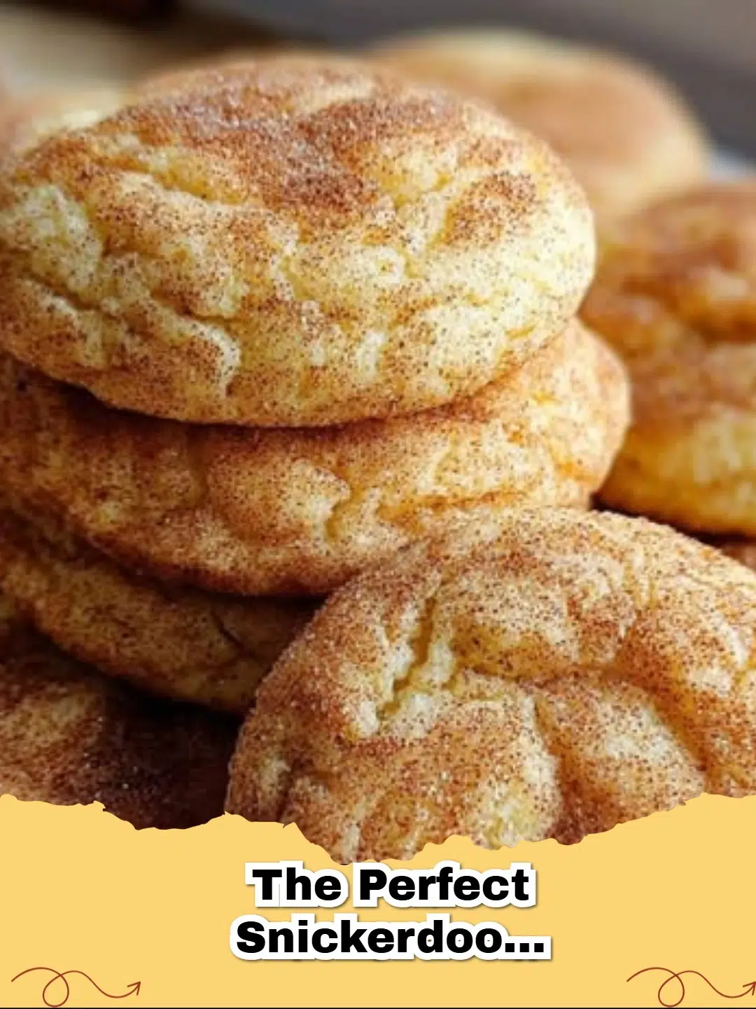 Pile of golden-brown snickerdoodle cookies coated in cinnamon sugar on a cooling rack.