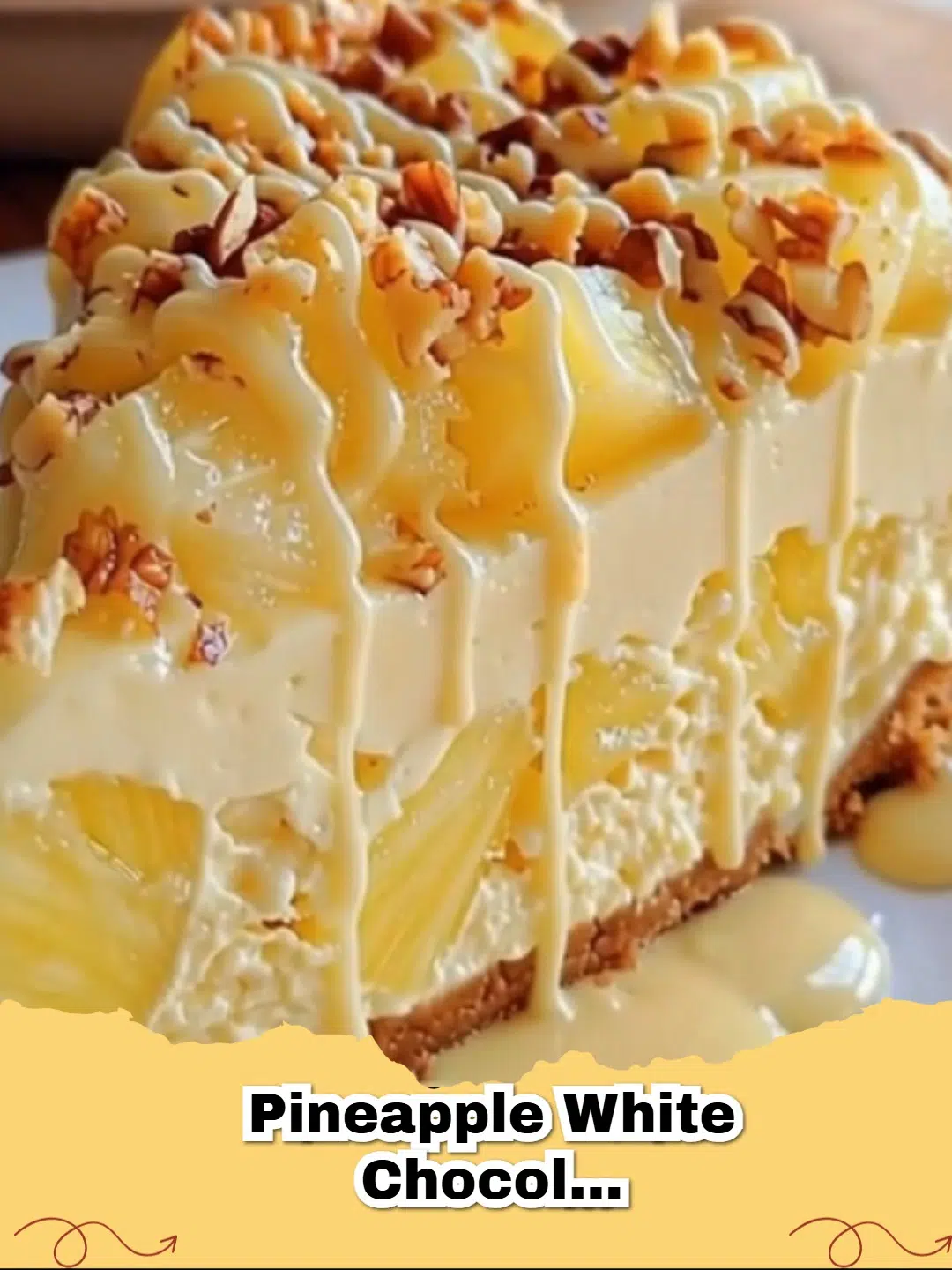 Delicious slice of Pineapple White Chocolate Cheesecake with golden crust and tropical toppings.