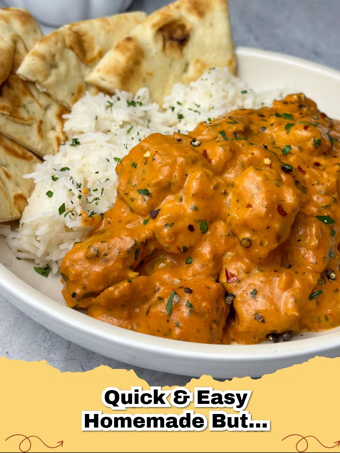 Creamy homemade butter chicken in a rustic bowl, served with rice and fresh cilantro.