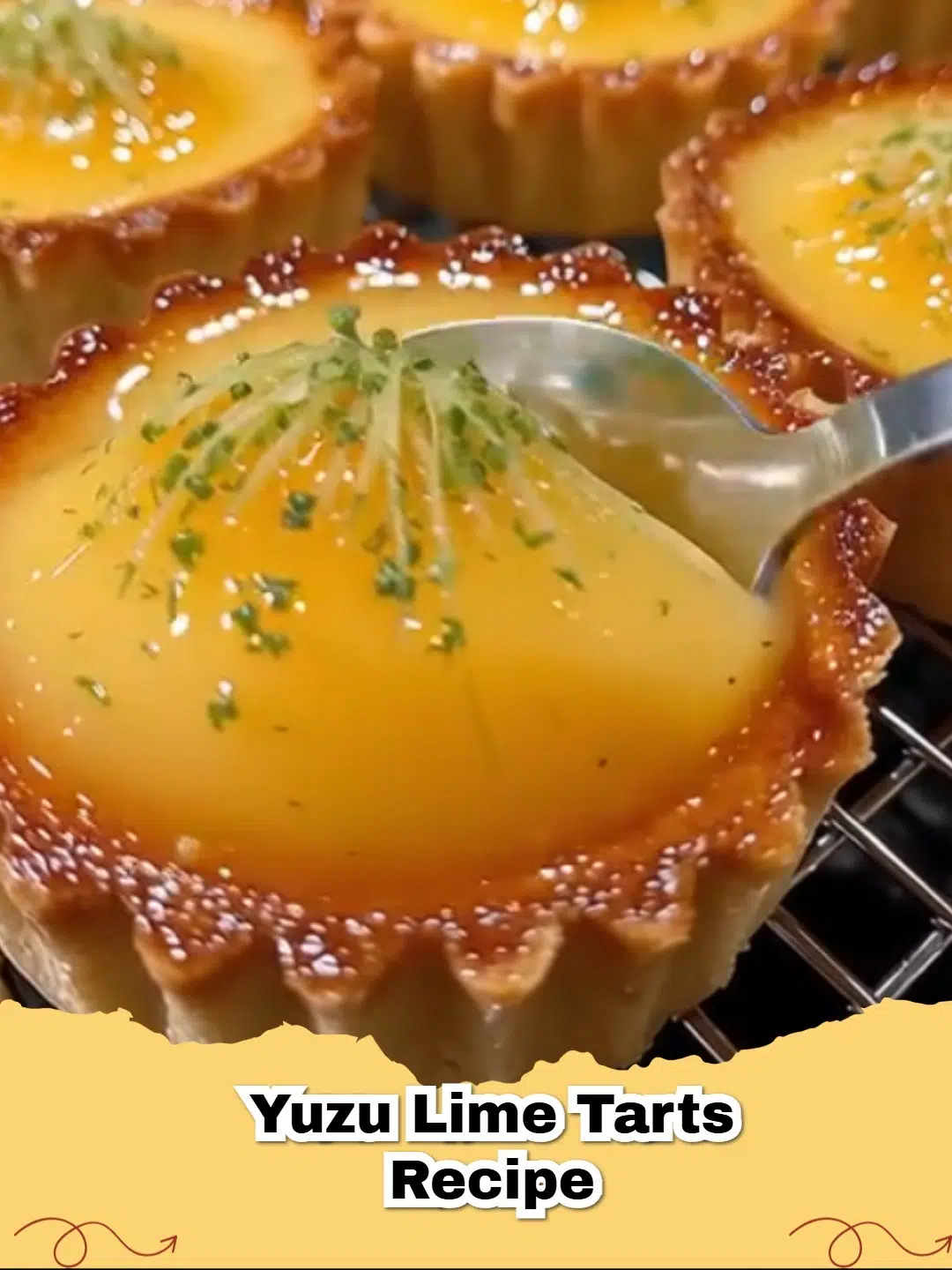 Close-up of a vibrant Refreshing Yuzu Lime Tart garnished with lime zest and a small slice of yuzu.