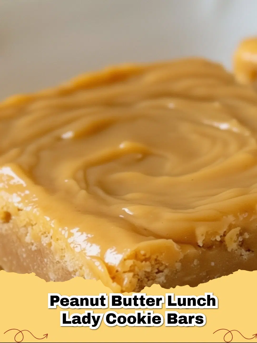 Delicious Peanut Butter Lunch Lady Cookie Bars with creamy frosting on a baking sheet.