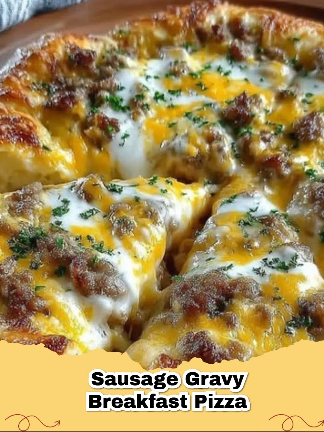 A delicious Sausage Gravy Breakfast Pizza topped with scrambled eggs, melted cheese, and savory sausage.