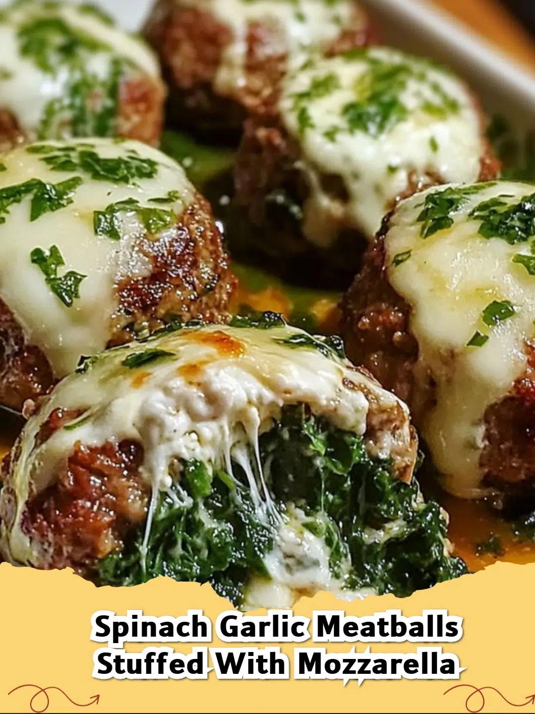 Delicious Spinach Garlic Mozzarella Stuffed Meatballs on a plate with marinara sauce.