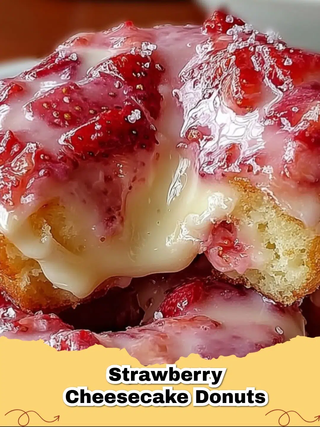 Delicious homemade Strawberry Cheesecake Donuts with fresh strawberries and a creamy swirl.