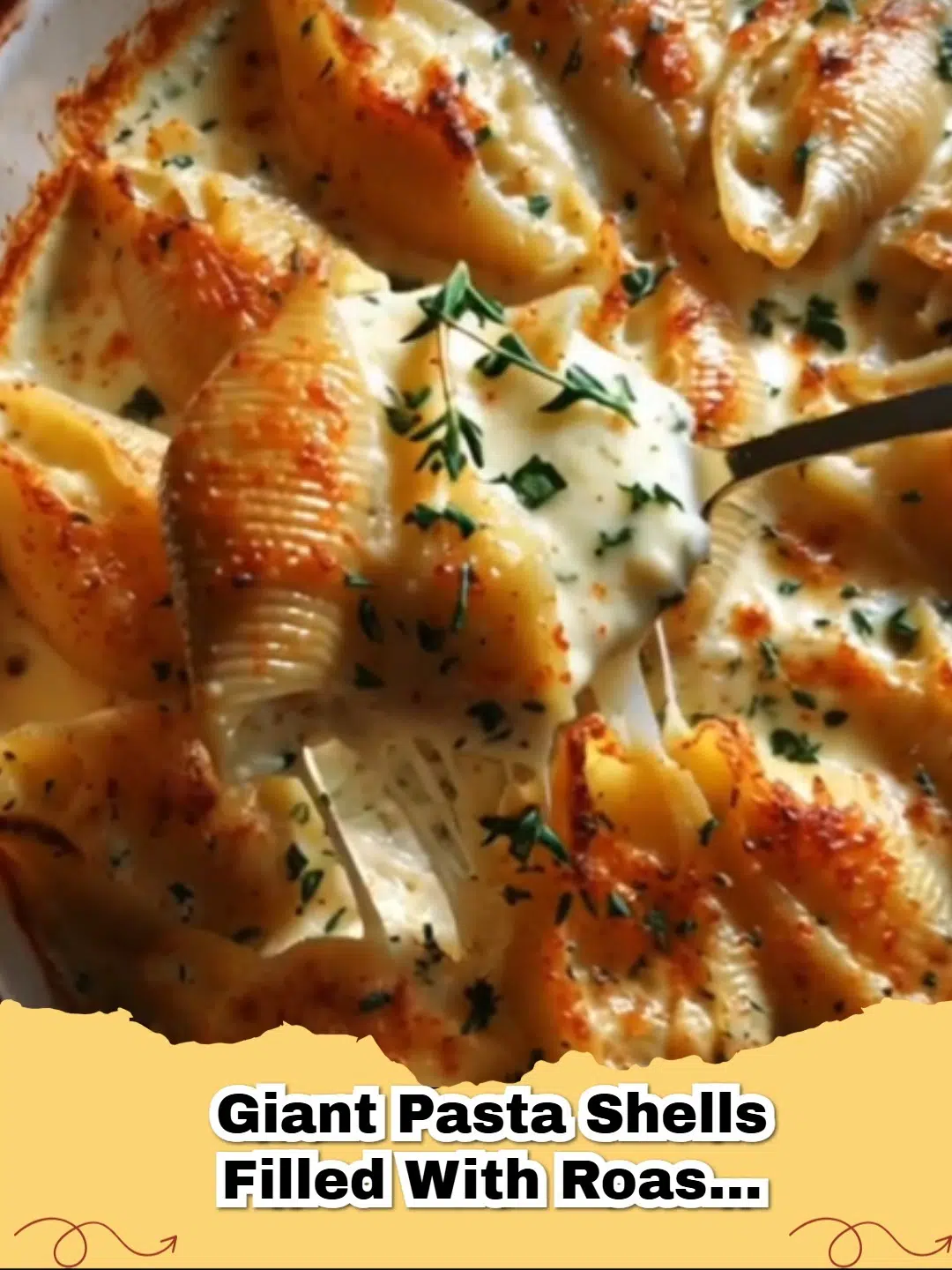 Close-up of baked giant pasta shells stuffed with creamy roasted garlic sauce and topped with melted Parmesan cheese, garnished with fresh herbs.