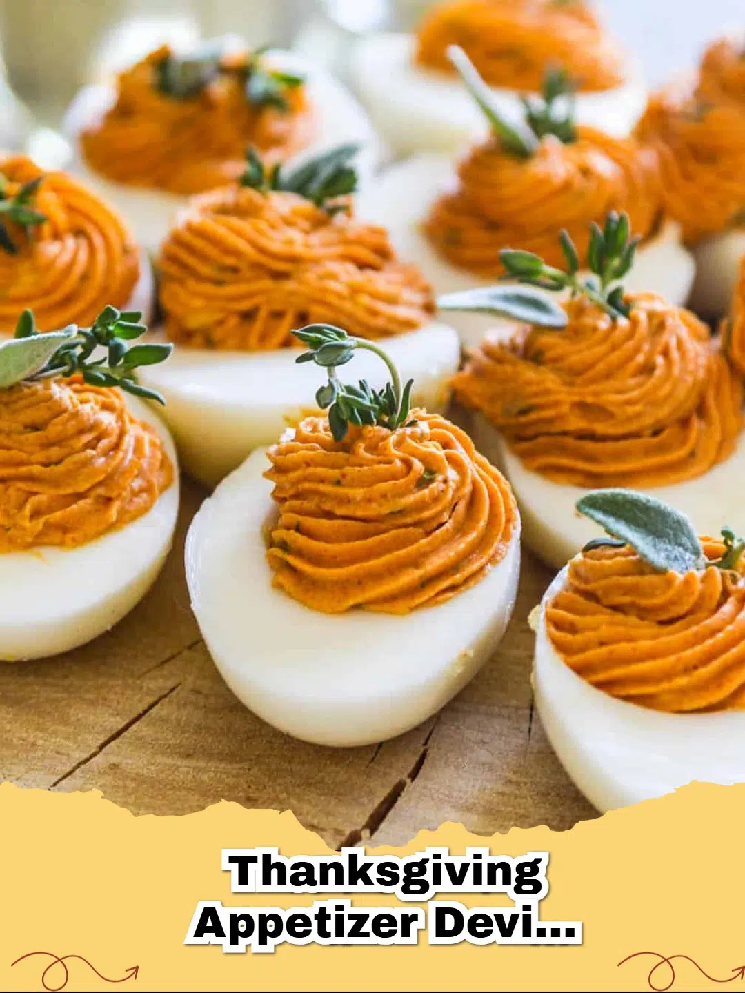 Platter of festive Thanksgiving Deviled Eggs garnished with paprika and fresh herbs on a holiday table setting