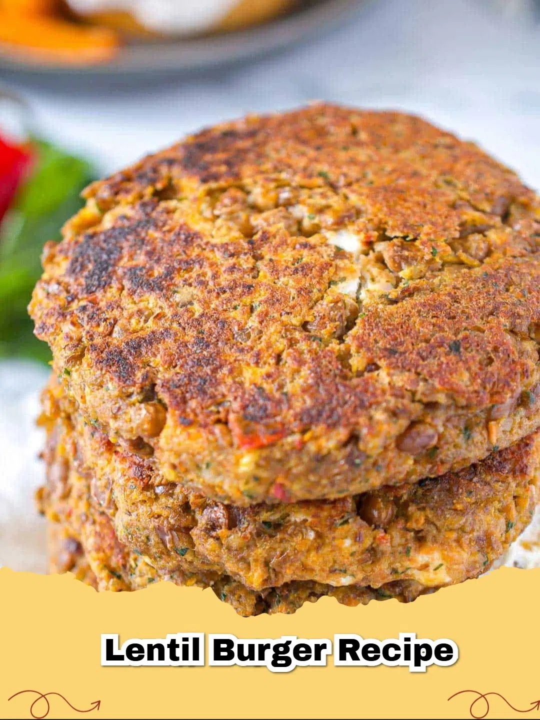 Hearty Vegetarian Goat Cheese Lentil Burgers with Tangy Yogurt Sauce, served on a bun with fresh tomato and arugula.