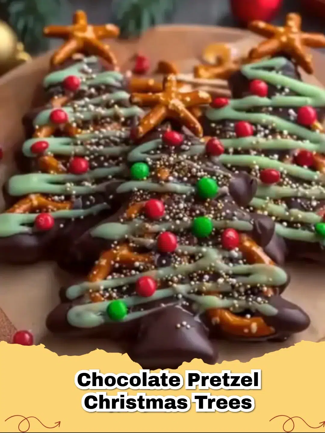 Close-up of adorable Chocolate Pretzel Christmas Trees decorated with colorful sprinkles and a star on top, set on parchment paper.