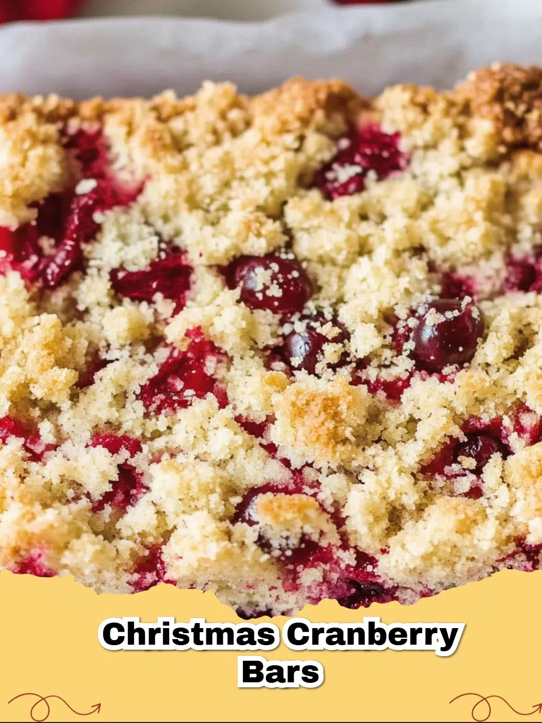 Delicious Christmas Cranberry Orange Bars with a sweet glaze, garnished with fresh cranberries and orange zest, on a festive holiday platter.
