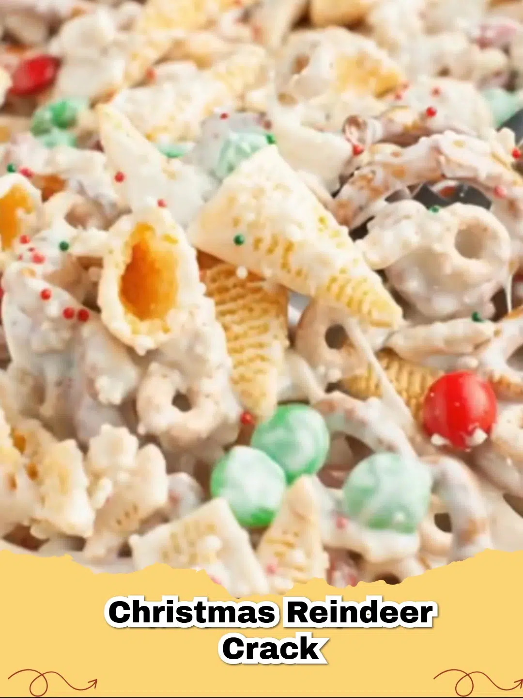 A close-up of festive Christmas Reindeer Crack with pretzels, chocolate, and sprinkles on a holiday background.