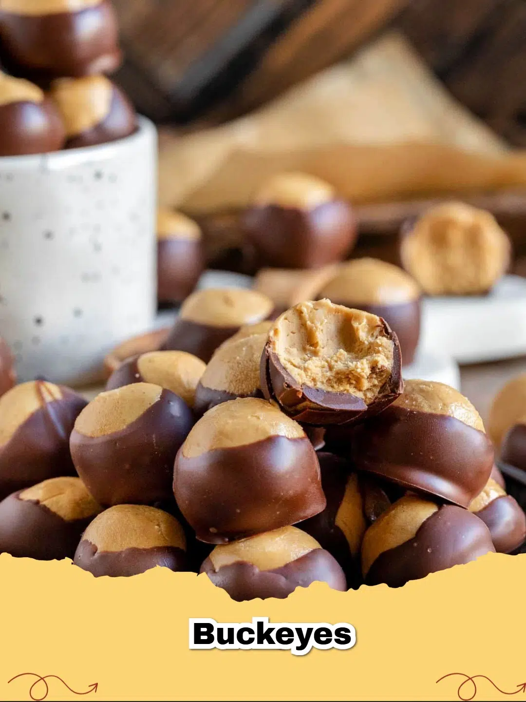 A close-up of a perfectly dipped Buckeye candy, showing its rich chocolate coating and creamy peanut butter center, on a white plate.