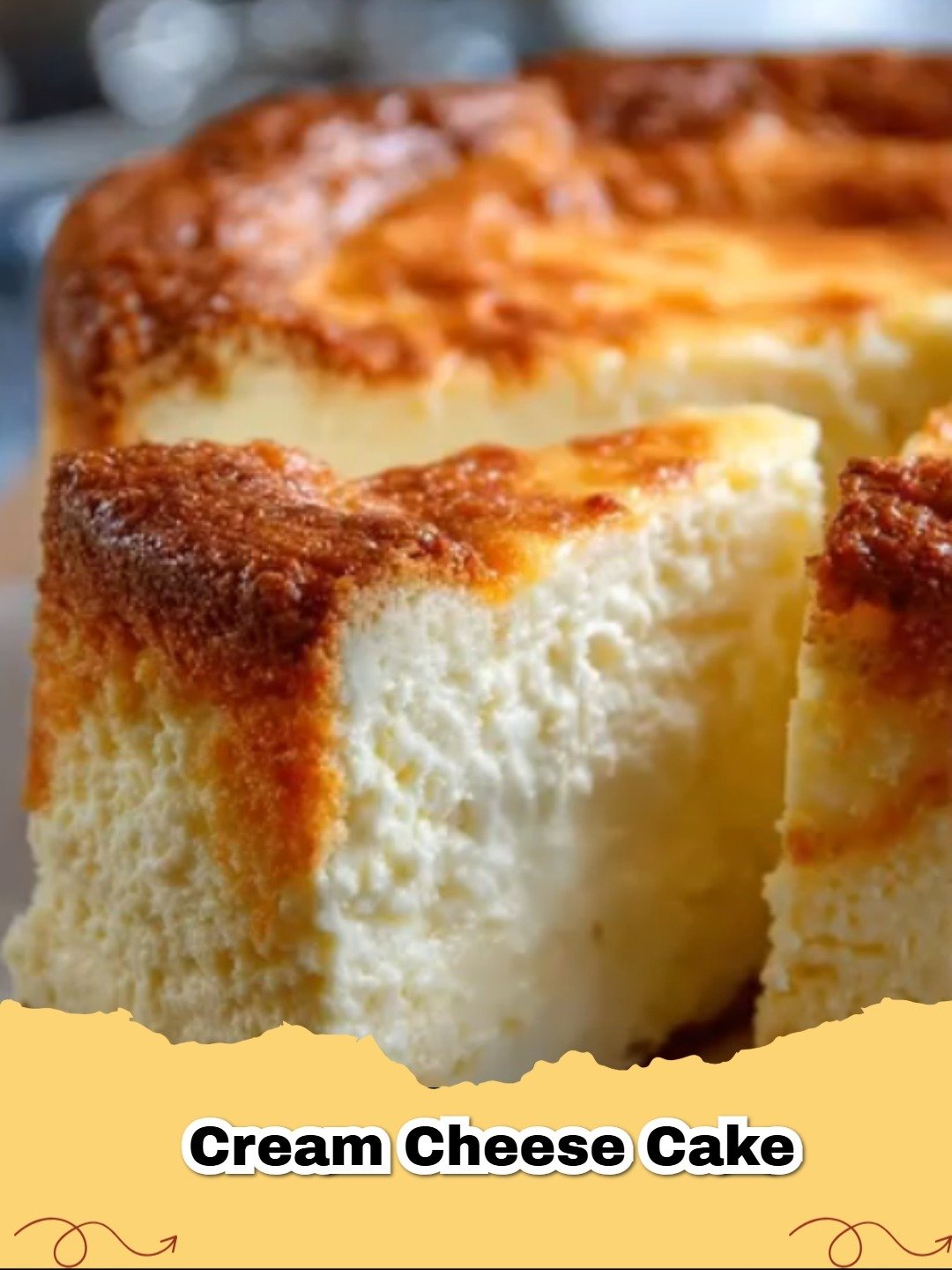 A beautifully baked Classic Cream Cheese Cake with a golden brown crust and smooth, creamy white filling, garnished with a few berries.