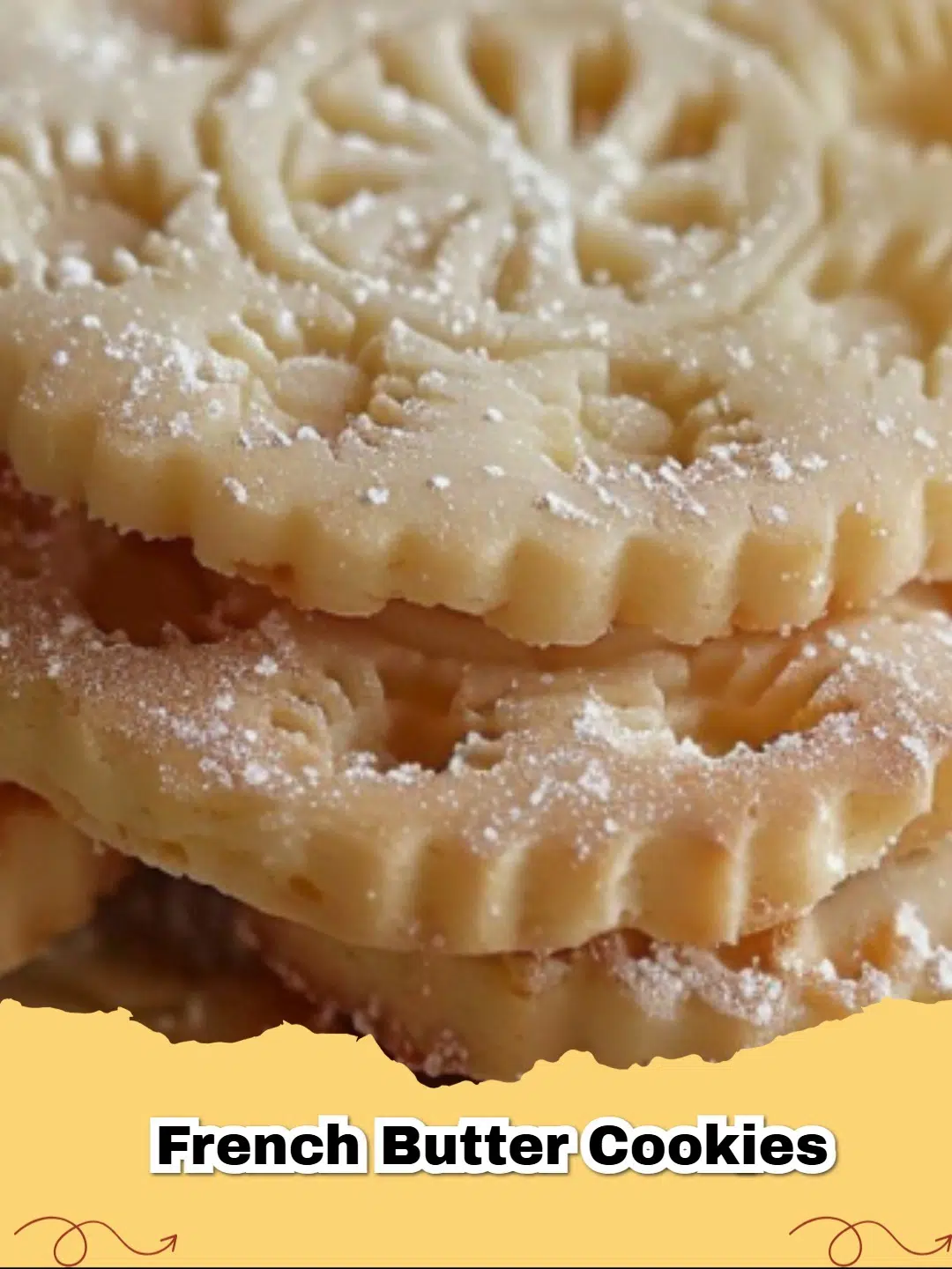 Plate of golden-brown Classic French Butter Cookies dusted with powdered sugar, ready to be served.