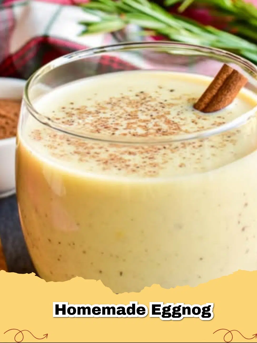 A glass of rich, creamy classic homemade eggnog garnished with grated nutmeg for the holidays.