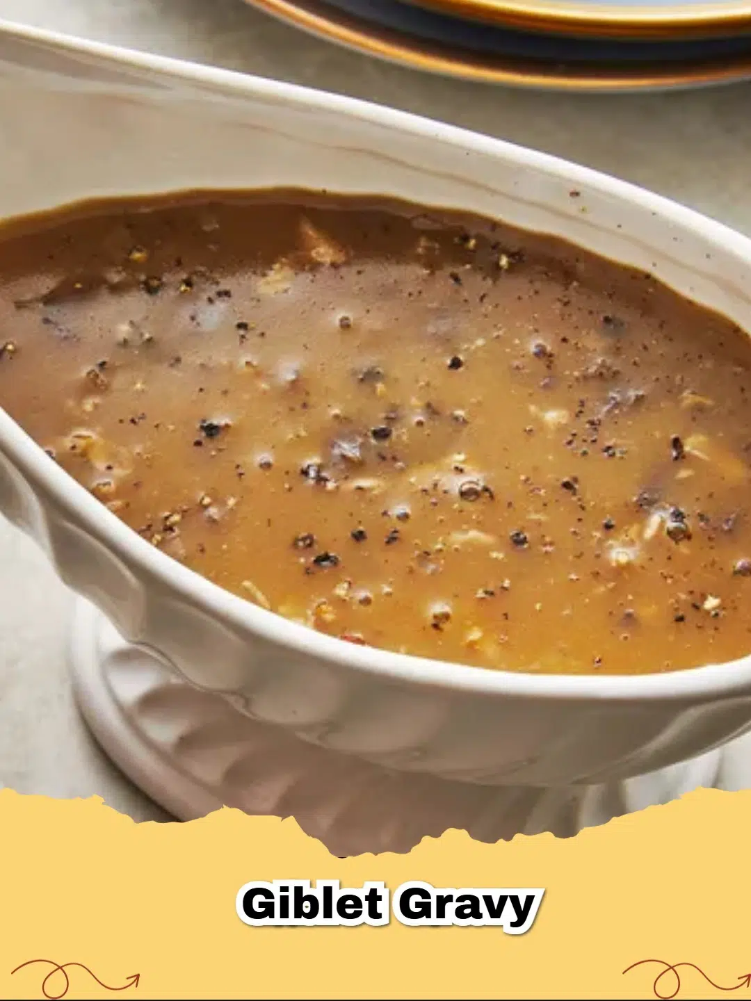 Rich homemade giblet gravy in a ceramic gravy boat, garnished with fresh herbs, ready to be poured.