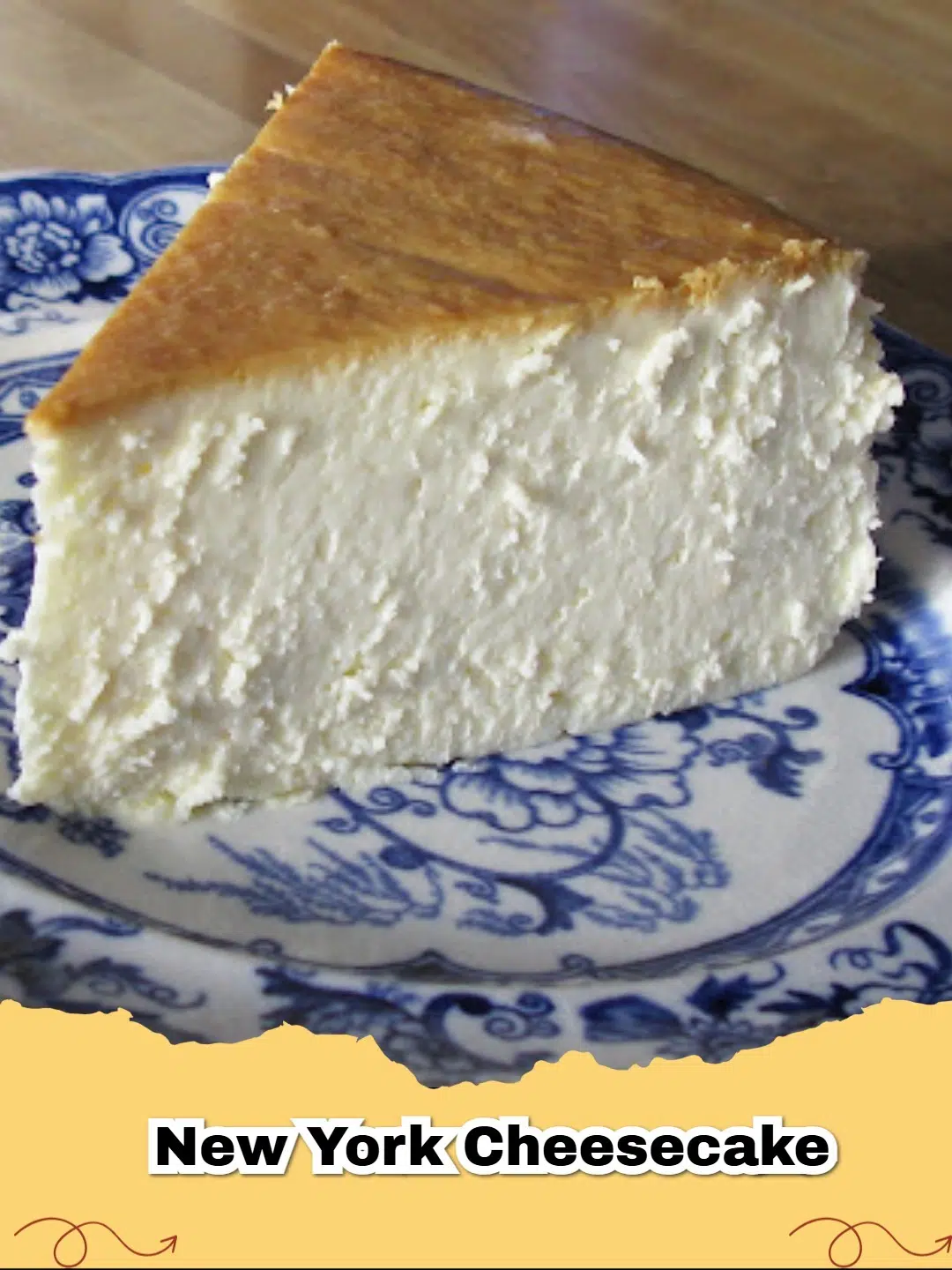 A glorious slice of classic New York Cheesecake with a golden graham cracker crust, topped with fresh berries, showcasing its dense and creamy texture.