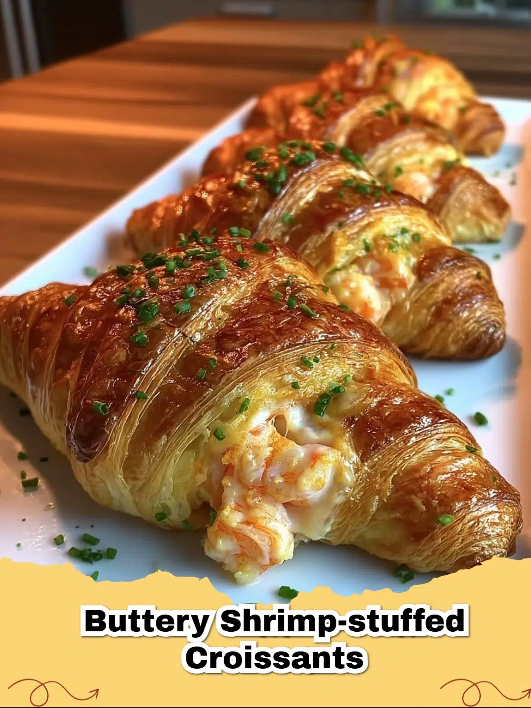 Golden, flaky creamy shrimp stuffed croissants on a baking sheet, ready to serve.
