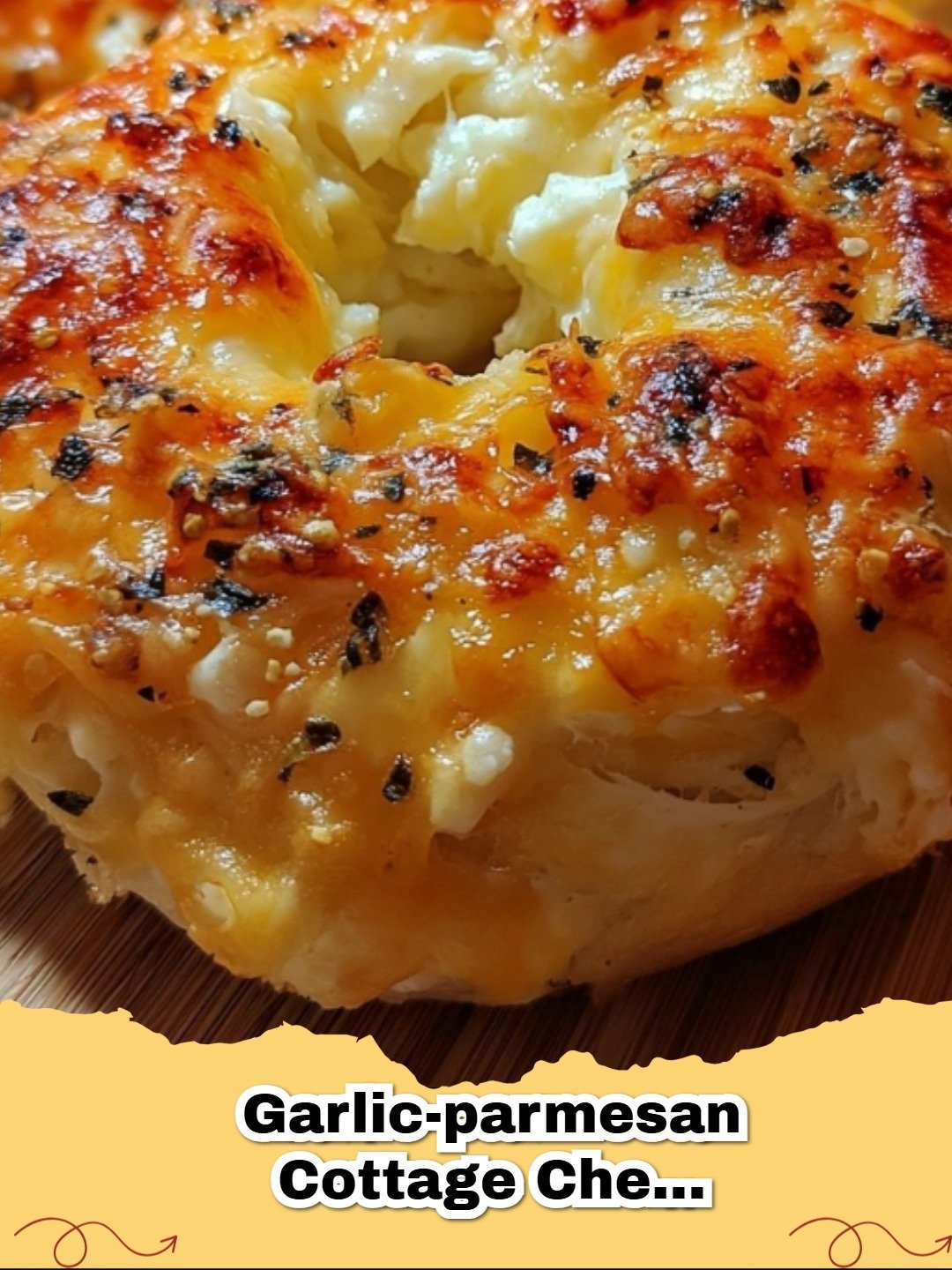 High-Protein Garlic Parmesan Cottage Cheese Bagels on a wooden board with cream cheese