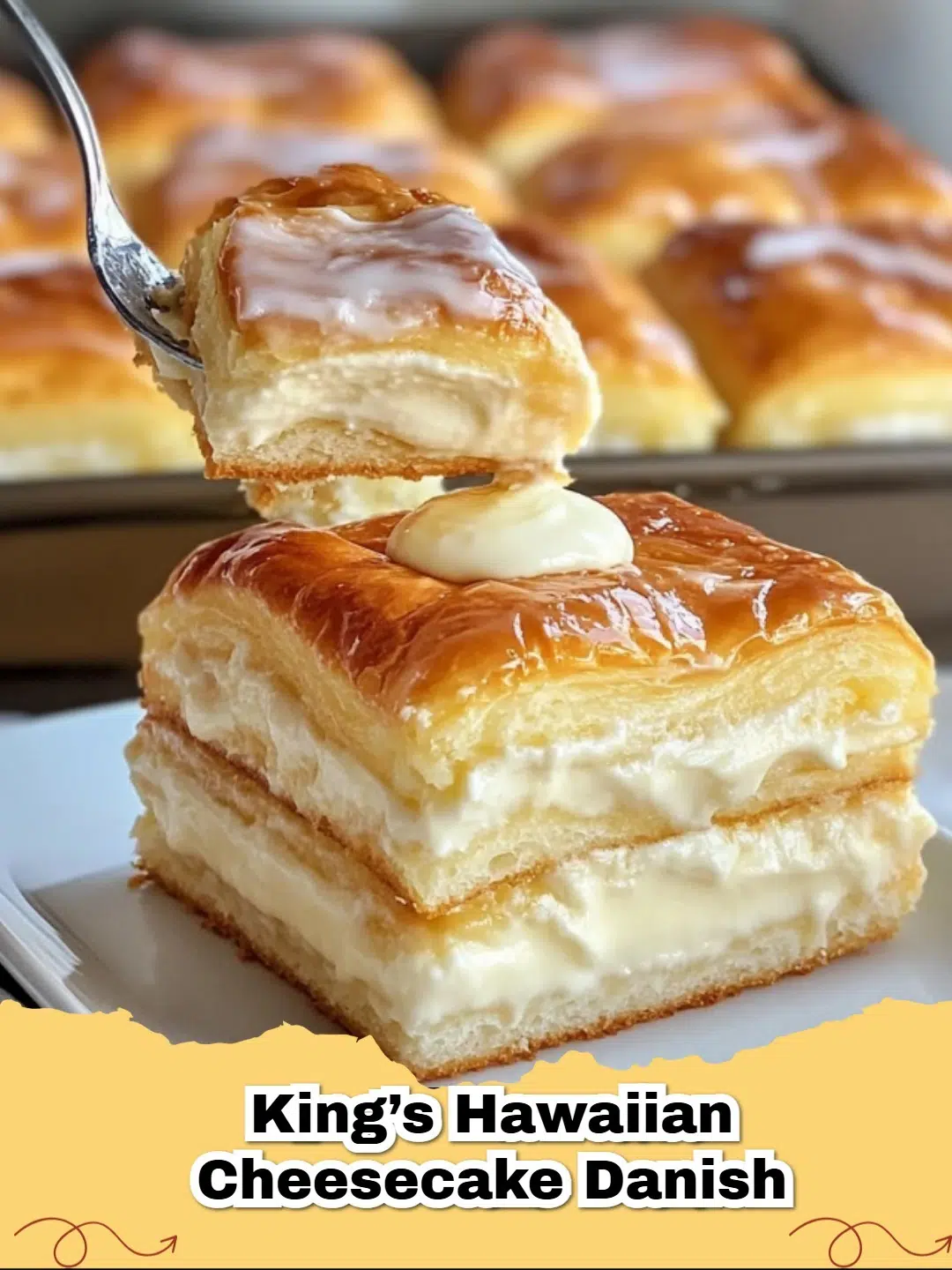 Close-up of golden brown King's Hawaiian Cheesecake Danishes with creamy white filling and powdered sugar.