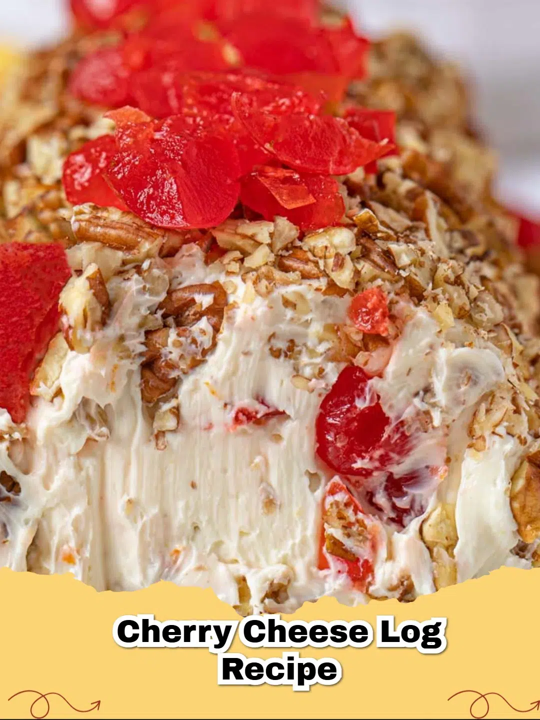 Festive No-Bake Cherry Cheese Log rolled in pecans on a white platter with crackers.
