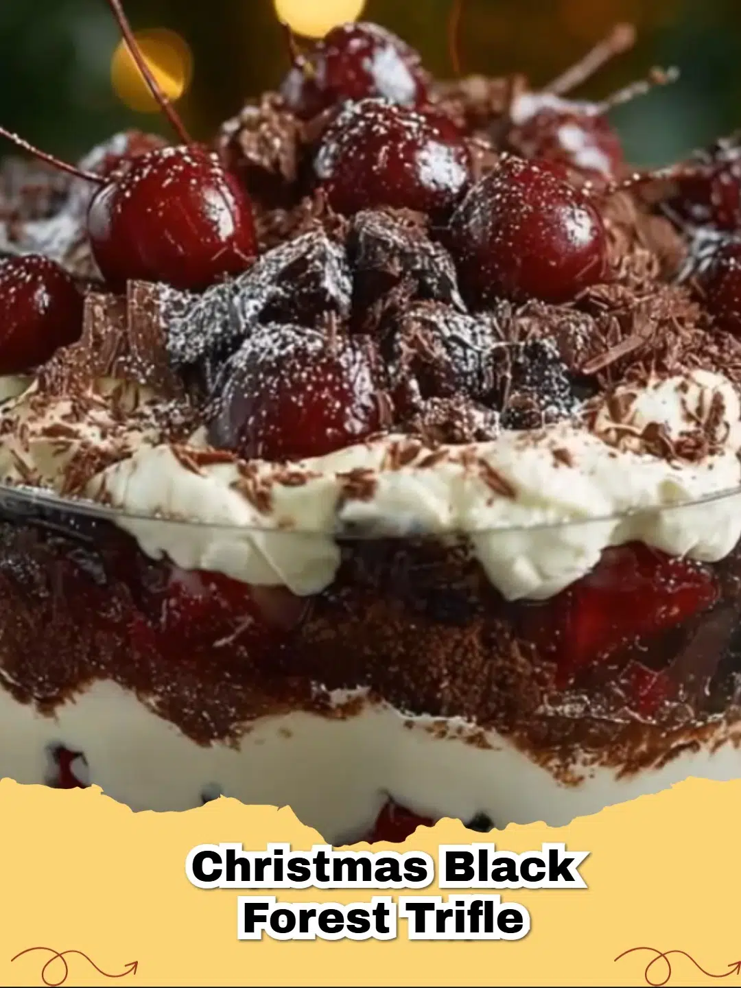 Delicious No-Bake Christmas Black Forest Trifle in a glass bowl, garnished with fresh cherries and chocolate shavings.