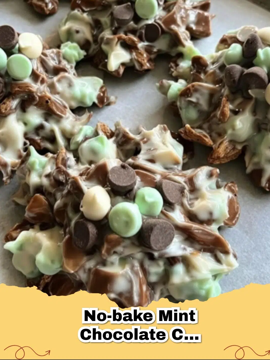 Pile of No-Bake Mint Chocolate Chip Clusters garnished with mini chocolate chips on a white plate