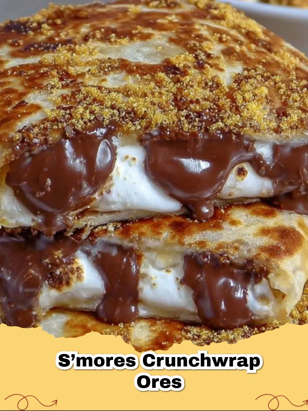 Golden-brown S'mores Crunchwrap with melted chocolate and toasted marshmallows oozing out.