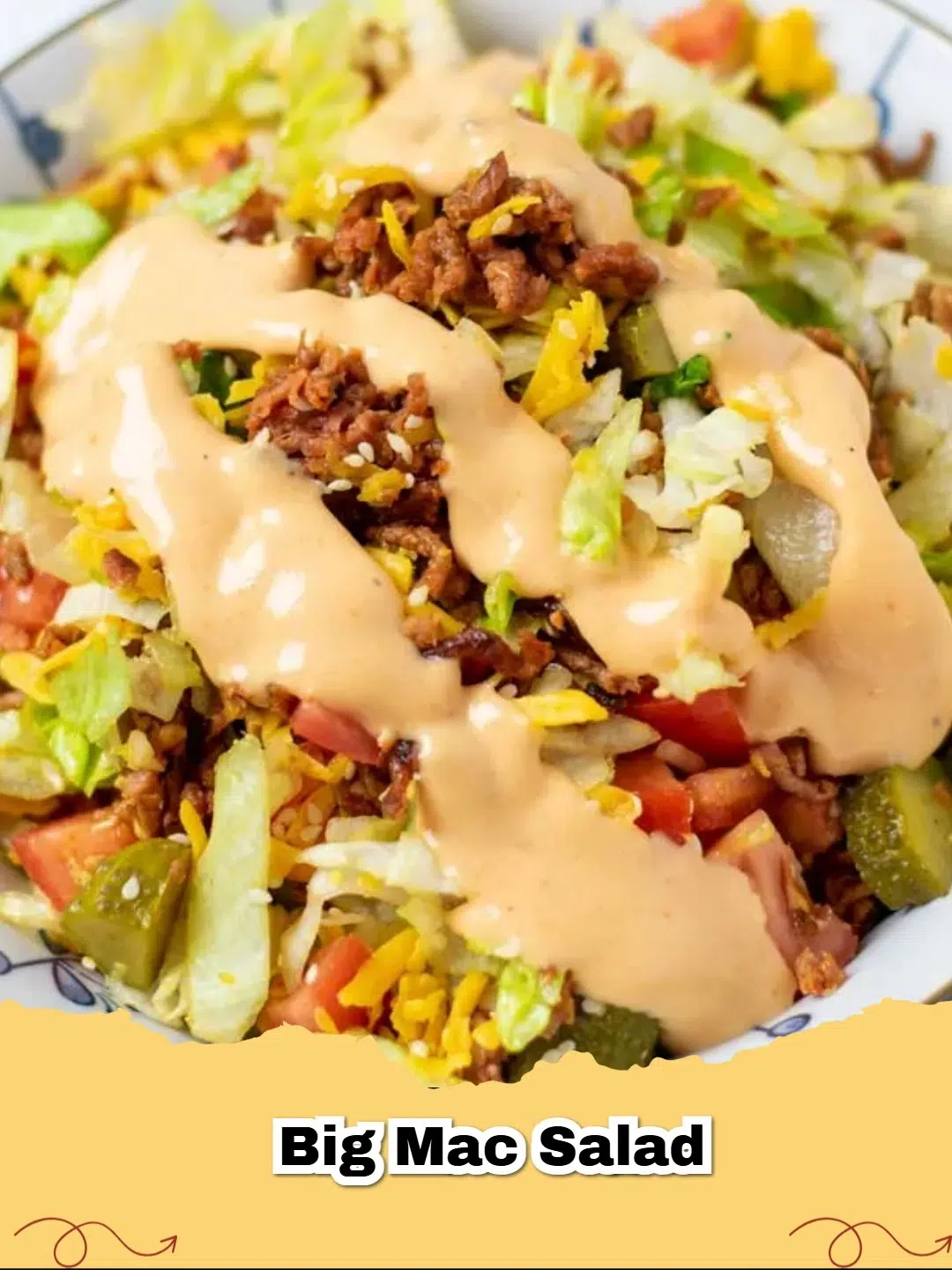 A vibrant Big Mac Salad in a bowl, featuring seasoned ground beef, crisp lettuce, pickles, cheese, and a creamy special sauce.