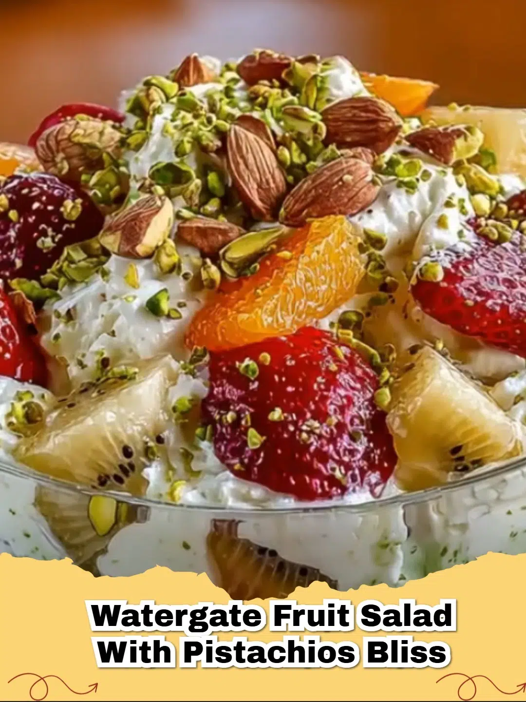 Delicious Watergate Pistachio Fruit Salad in a glass bowl, garnished with fresh mint.