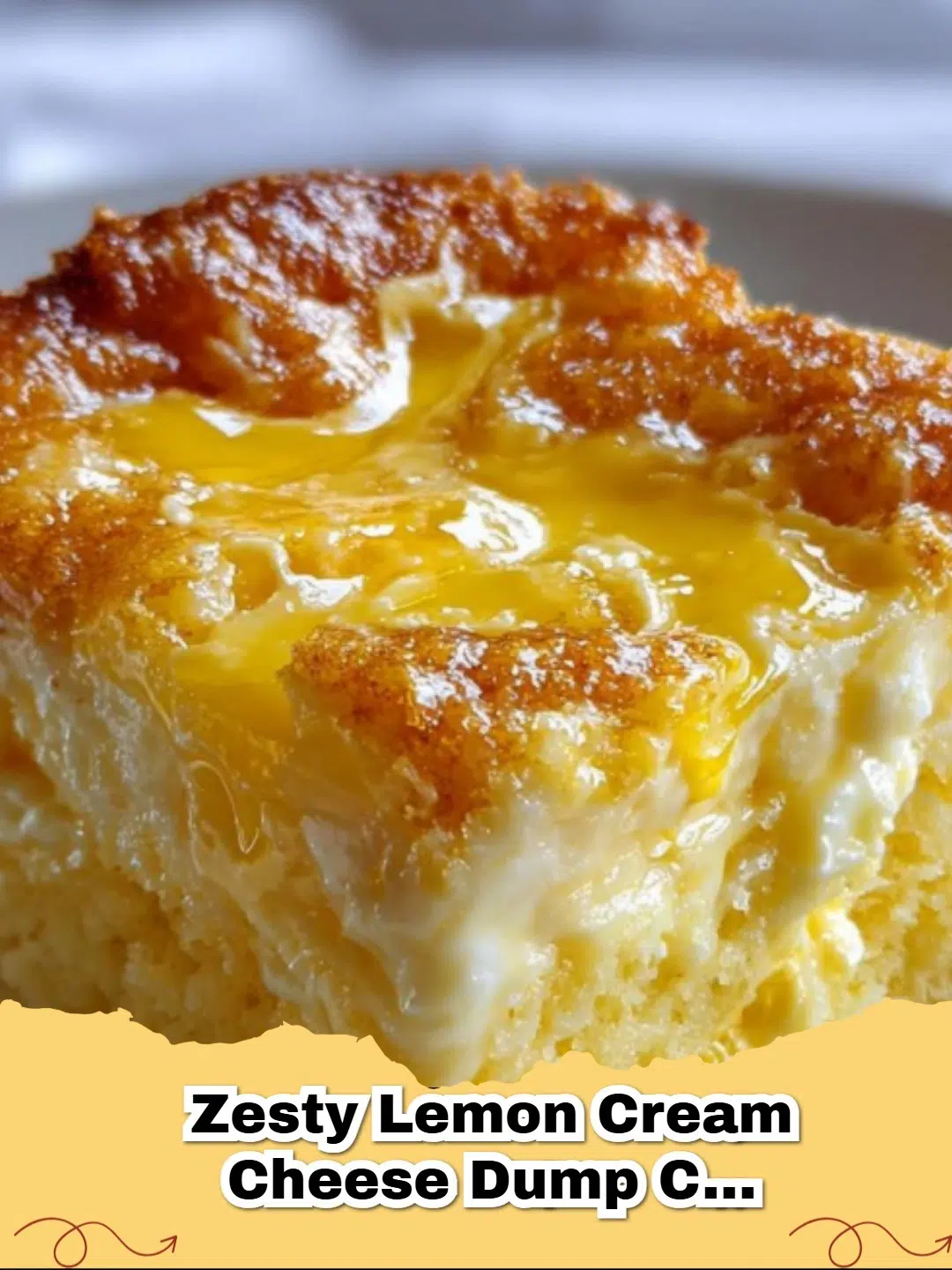 Slice of Zesty Lemon Cream Cheese Dump Cake with a fork, showing layers of lemon filling and cream cheese swirl.
